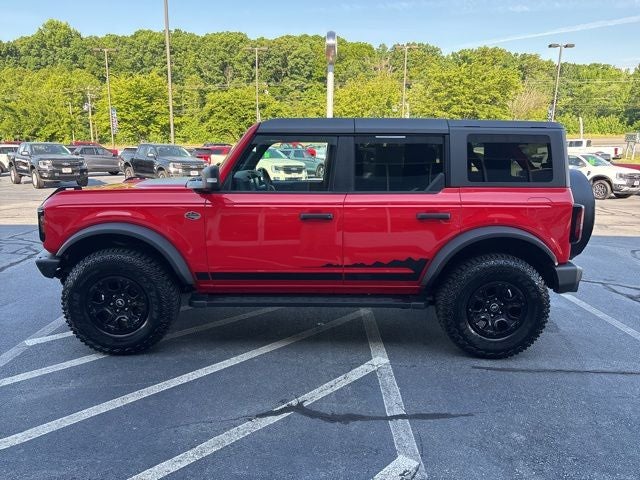 2024 Ford Bronco Wildtrak in Race Red — front three-quarter view