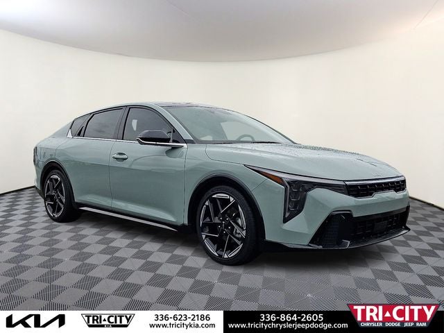 2025 Kia K4 GT-Line in Morning Haze — front three-quarter view